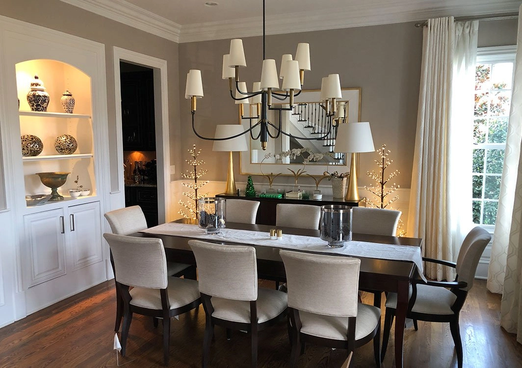 A dining room with a table and chairs