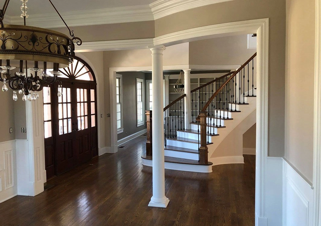 A large open foyer with stairs leading to the second floor.