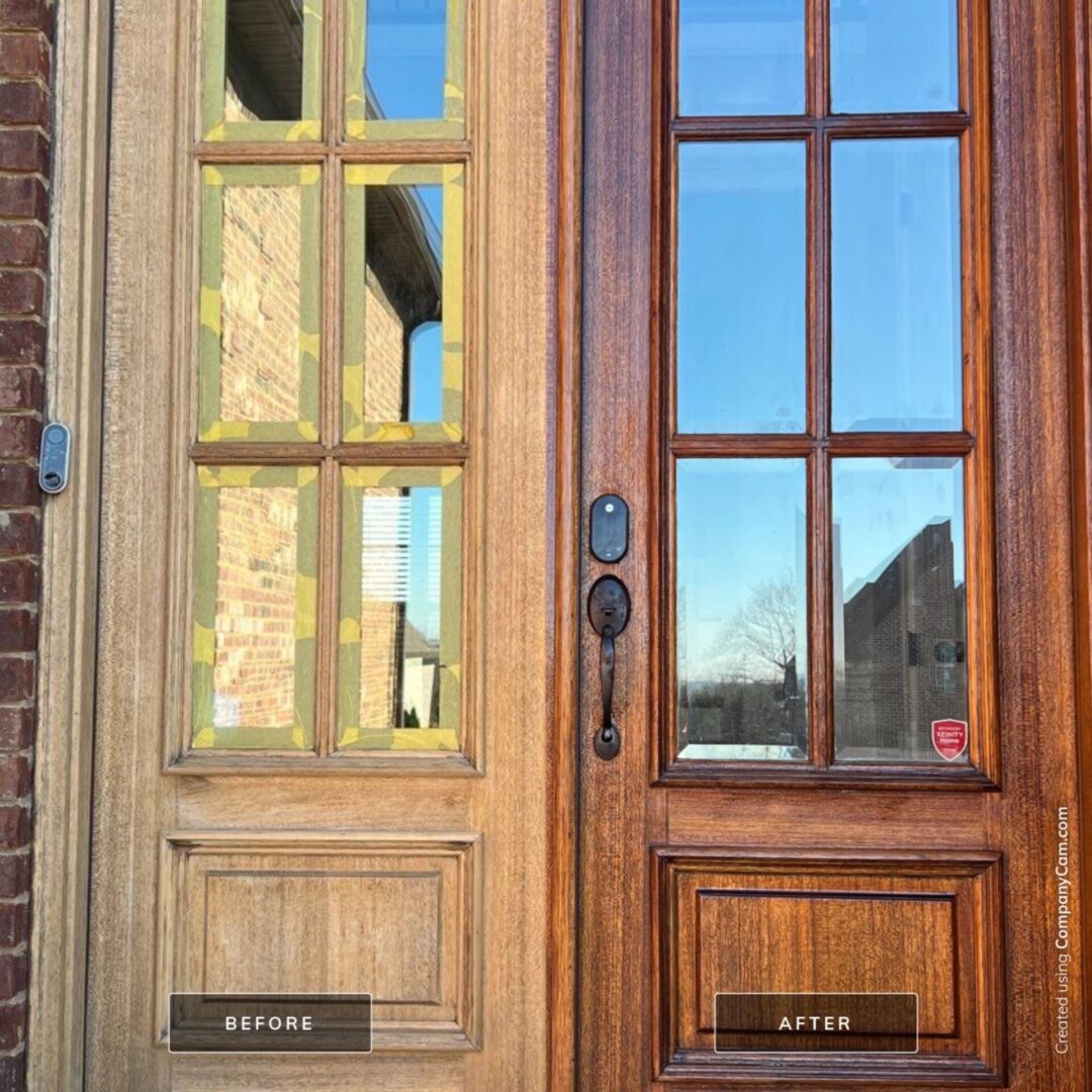 A pair of doors with the reflection of a house in them.